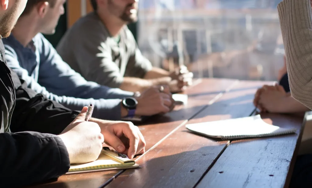 Image of a team discussing a project, symbolizing the process of reaching consensus.