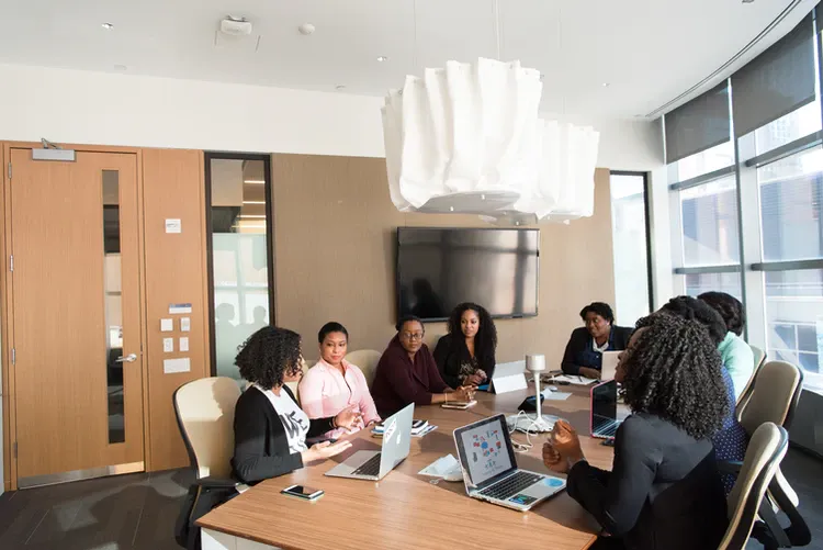 Image of a team using sticky notes during a 'buresuto' session.