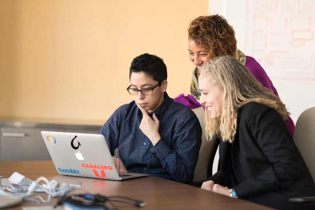 Image of a diverse group of business people collaborating, with the concept of 'top-down' being discussed.