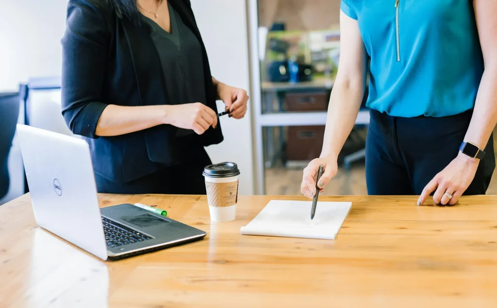 Image of a team collaborating in an office, illustrating Hōrensō in action.