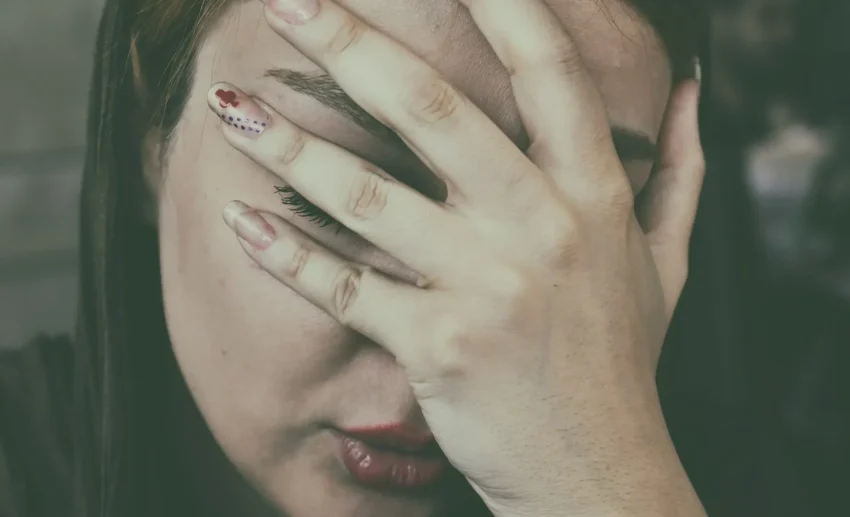 Image of a person looking apologetic, symbolizing a business mistake or forgetfulness.