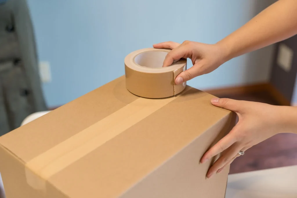 Image of professional movers handling boxes, symbolizing reliable moving services.
