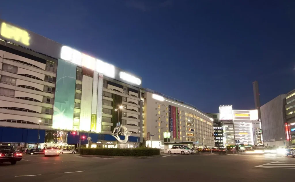 Image of the Ikebukuro cityscape, highlighting the busy transportation hub.