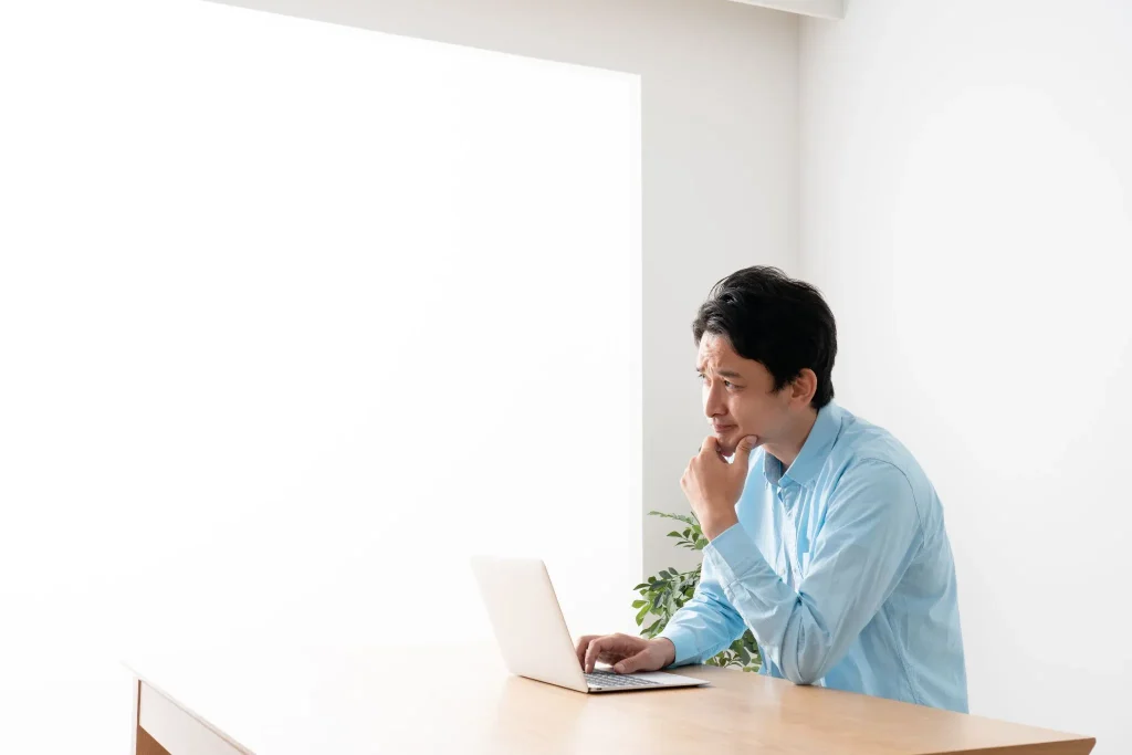 Image showing a person searching for real estate online and in person.