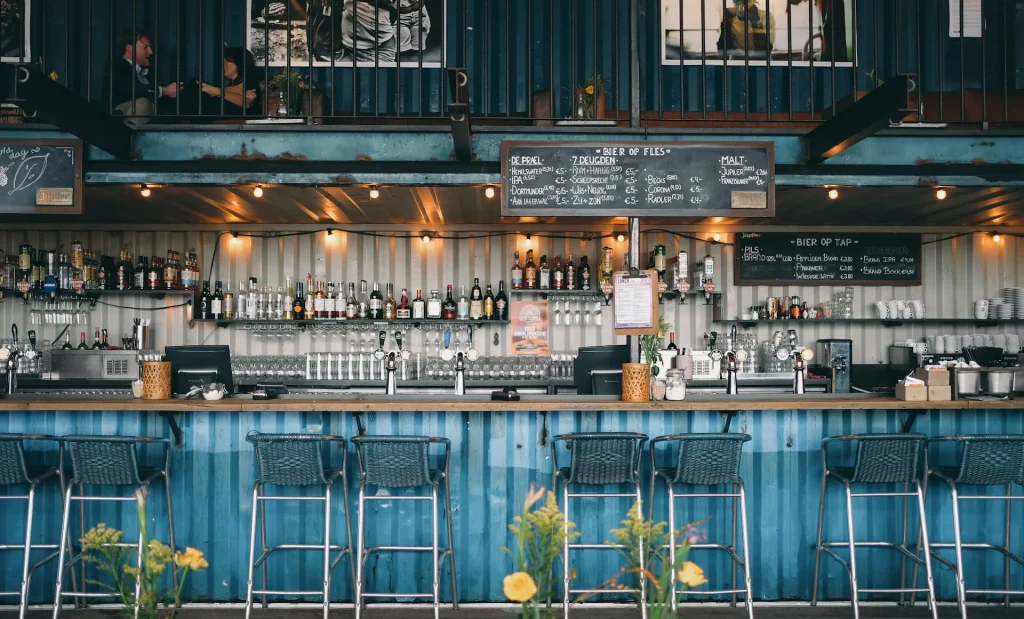 Image of the modern, yet cozy interior of OBI Hostel, highlighting its cafe/bar area.