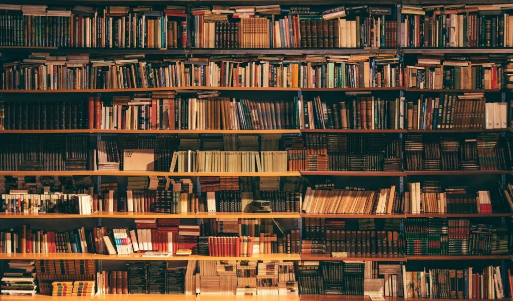 Image of a quiet library reading room with people studying.