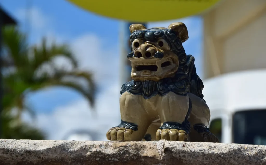 Image of the iconic entrance to Okinawa World, featuring traditional Okinawan architecture.