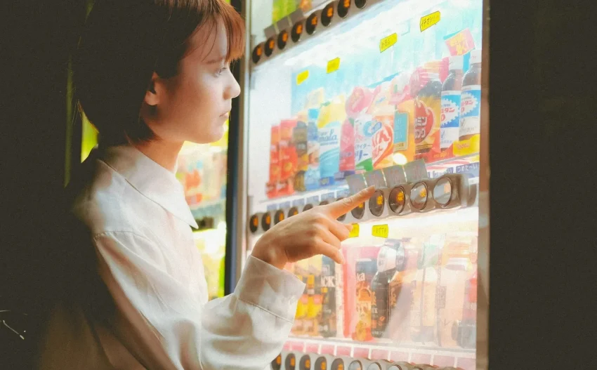Image of a variety of unusual products being sold in a Japanese vending machine.