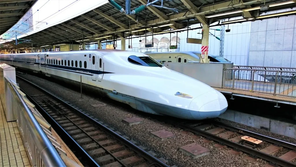 Image of a Shinkansen train with a 'FREE Wi-Fi' sticker visible, indicating availability.