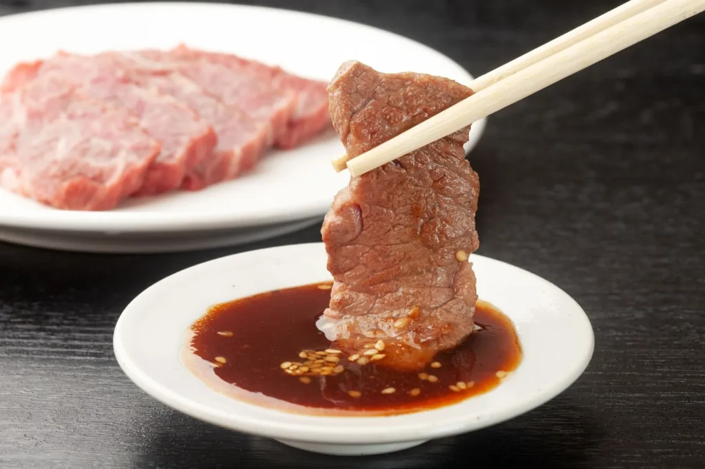 Image of Yakiniku (Japanese BBQ) being grilled, specifically at a Halal-certified restaurant.