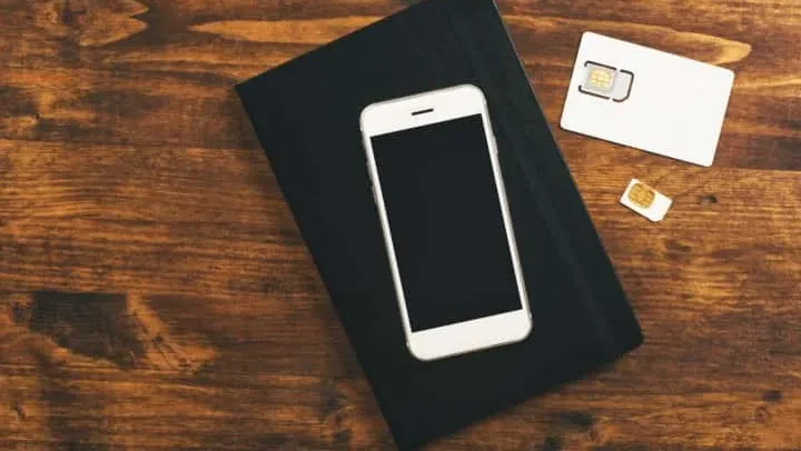 Image of a prepaid SIM card package on a Japanese street, symbolizing easy access for tourists.