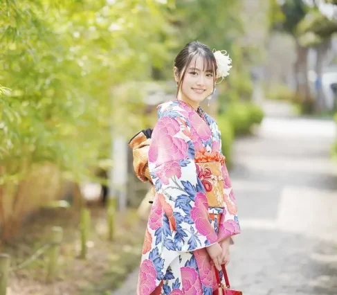 Image of a woman wearing a vibrant Furisode kimono with long sleeves.