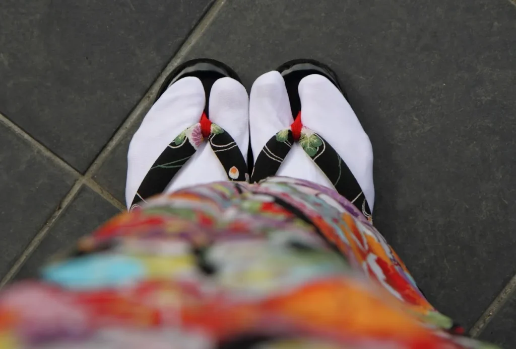 Image showing Zōri (flat sandals), Geta (raised wooden clogs), and Tabi (split-toe socks).